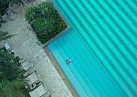 Large pool with person enjoying water